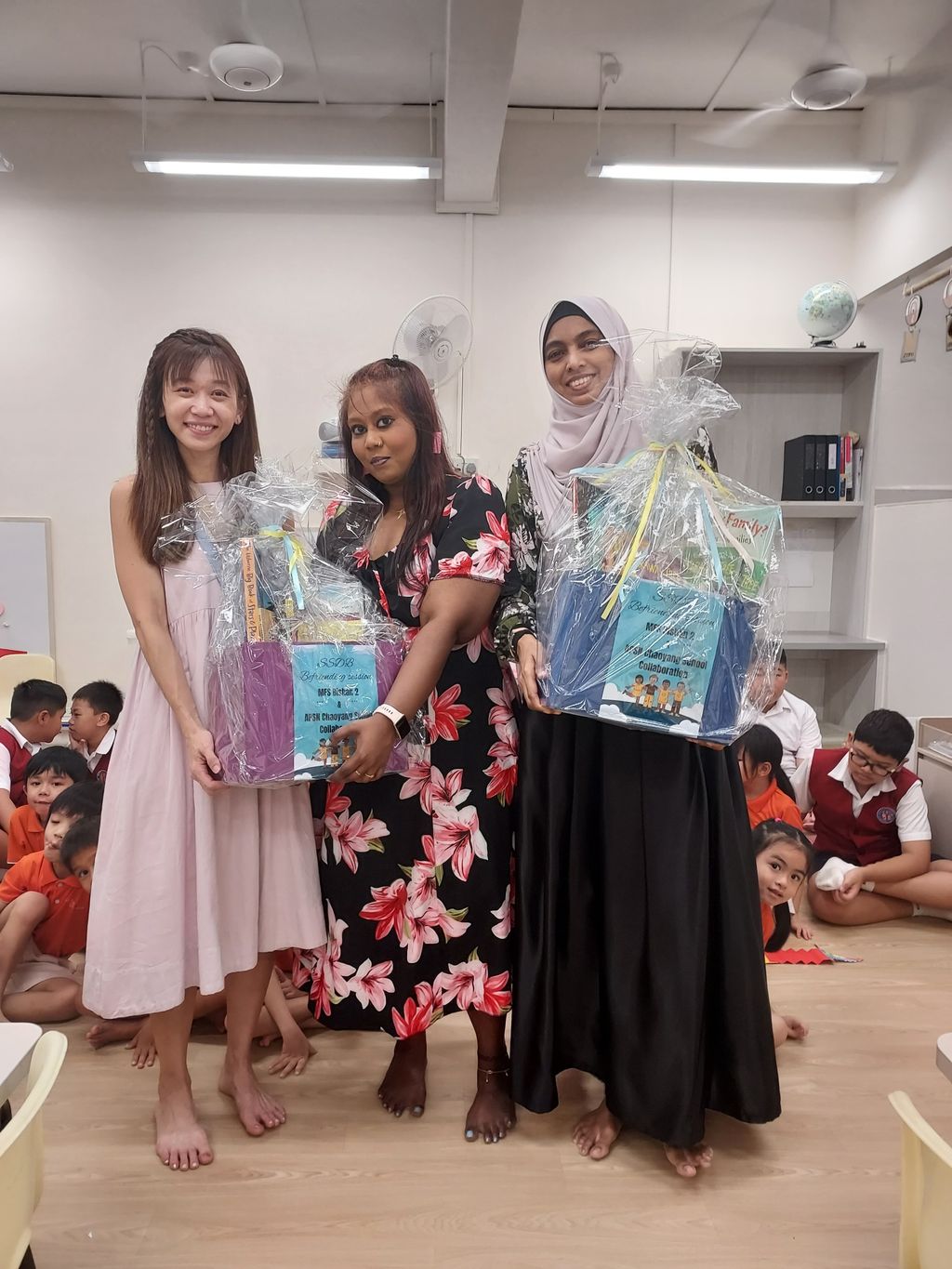 Handing over the hampers and bookmarks