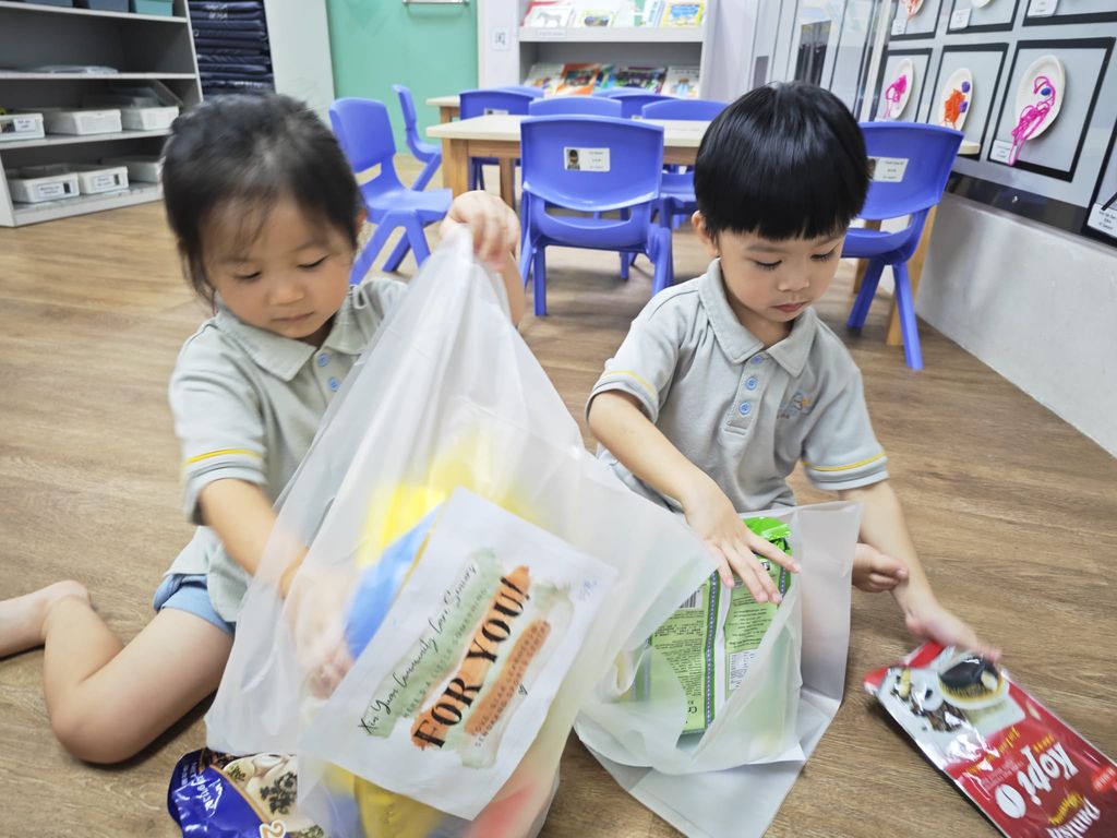 Packing food donated by parents for local seniors in need.