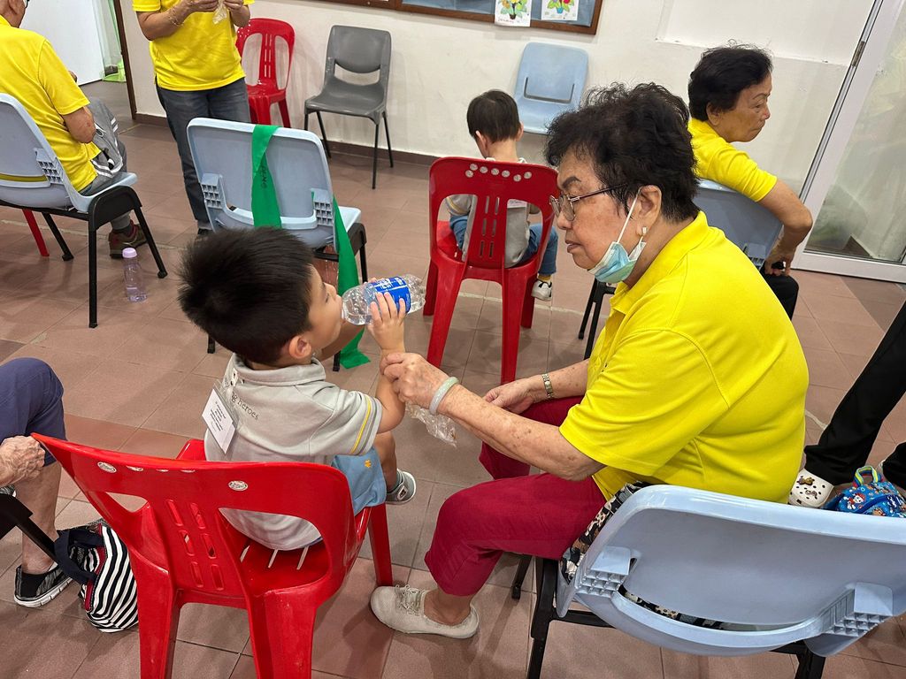Doing exercises and having snacks together at Xin Yuan Community Care