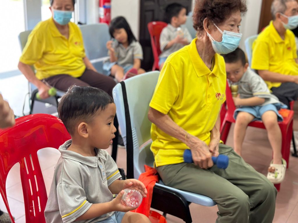 Doing exercises and having snacks together at Xin Yuan Community Care — photo 2