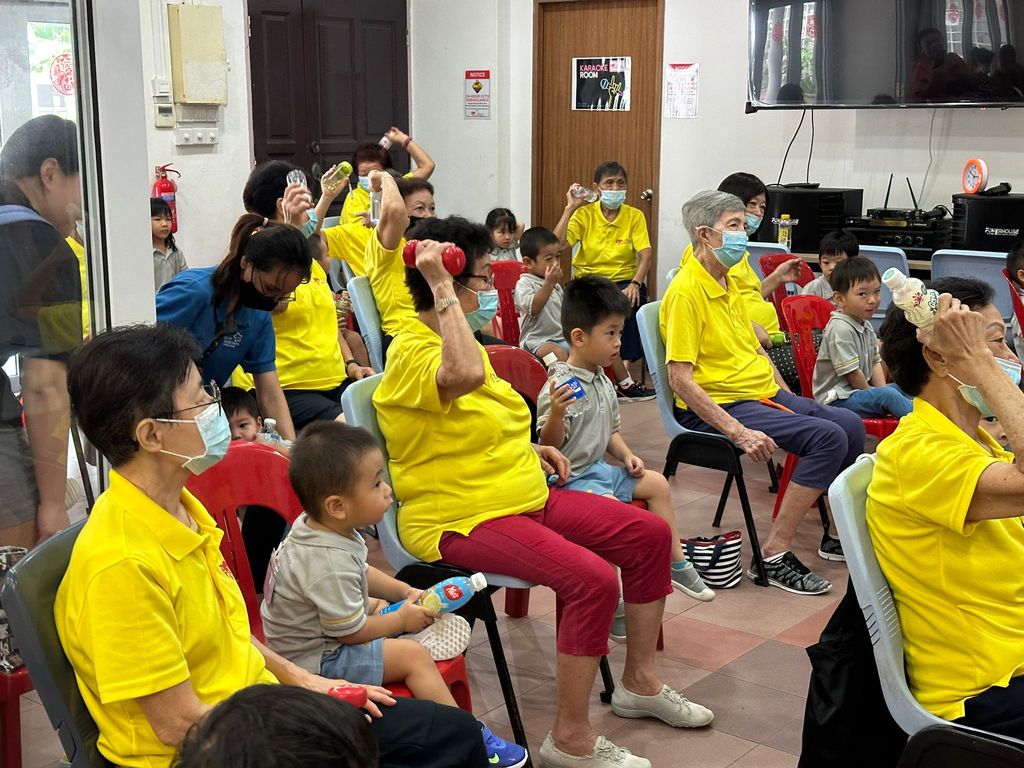 Doing exercises and having snacks together at Xin Yuan Community Care — photo 3