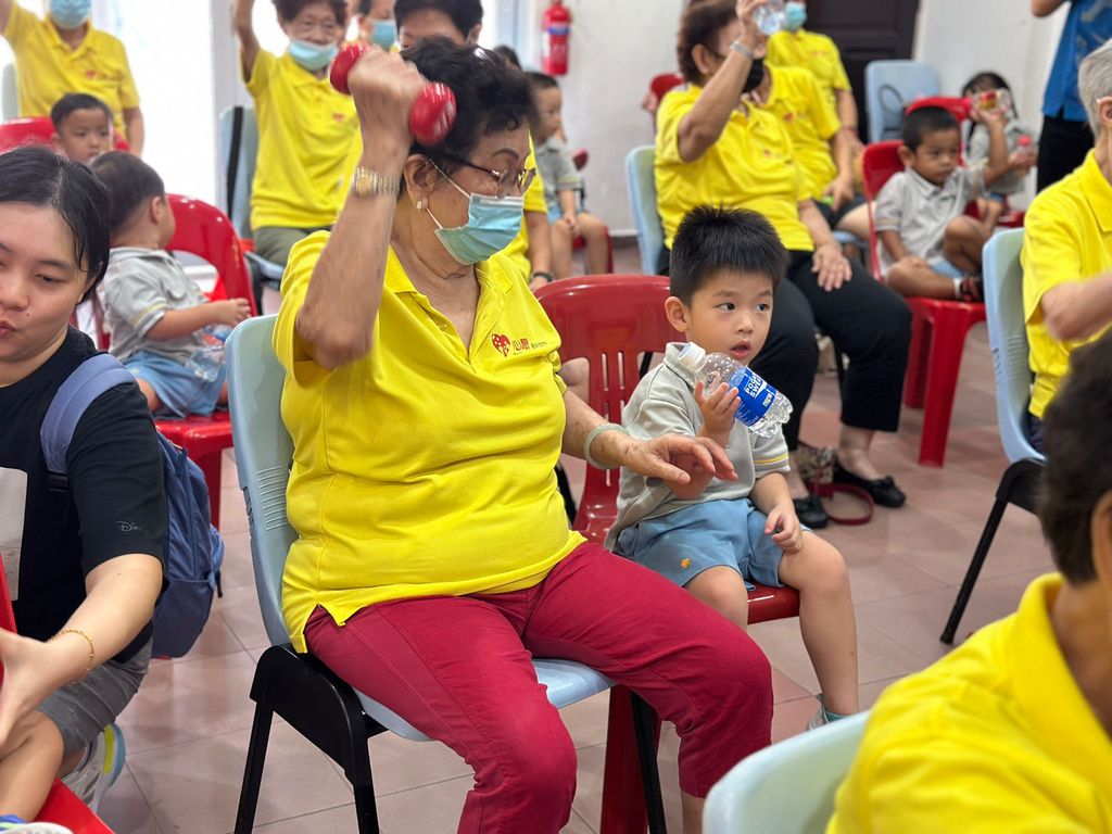Doing exercises and having snacks together at Xin Yuan Community Care — photo 5