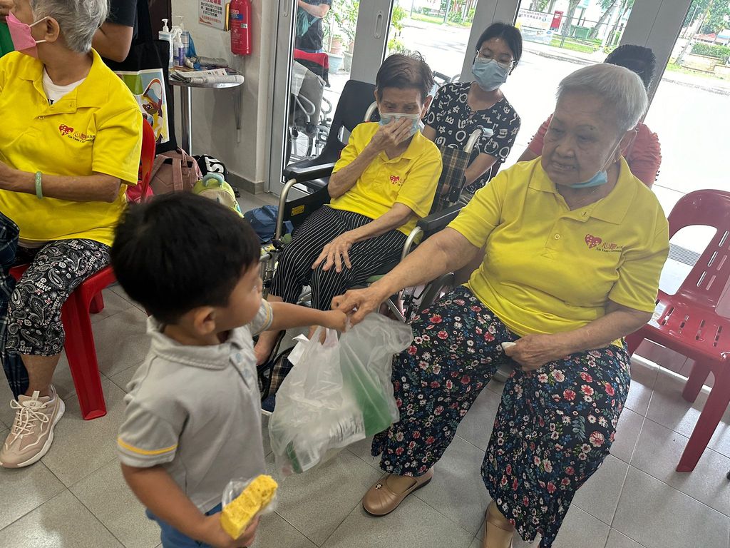 Doing exercises and having snacks together at Xin Yuan Community Care — photo 6
