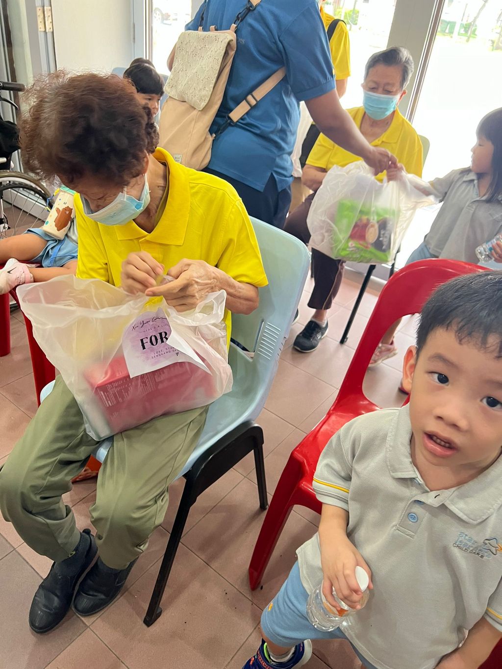 Doing exercises and having snacks together at Xin Yuan Community Care — photo 7