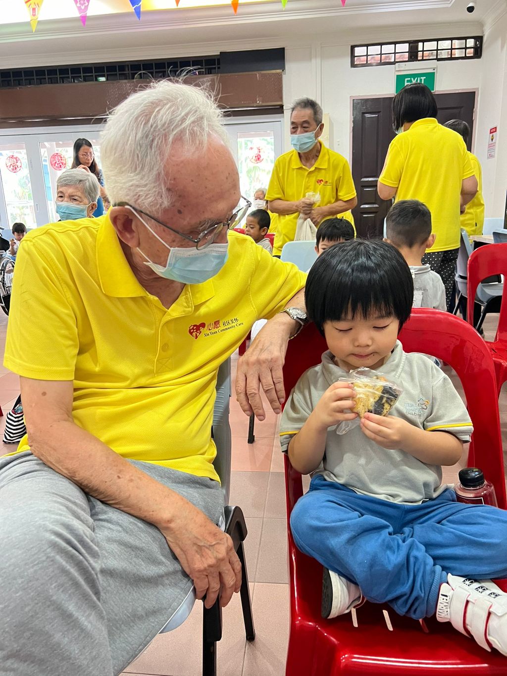 Doing exercises and having snacks together at Xin Yuan Community Care — photo 9