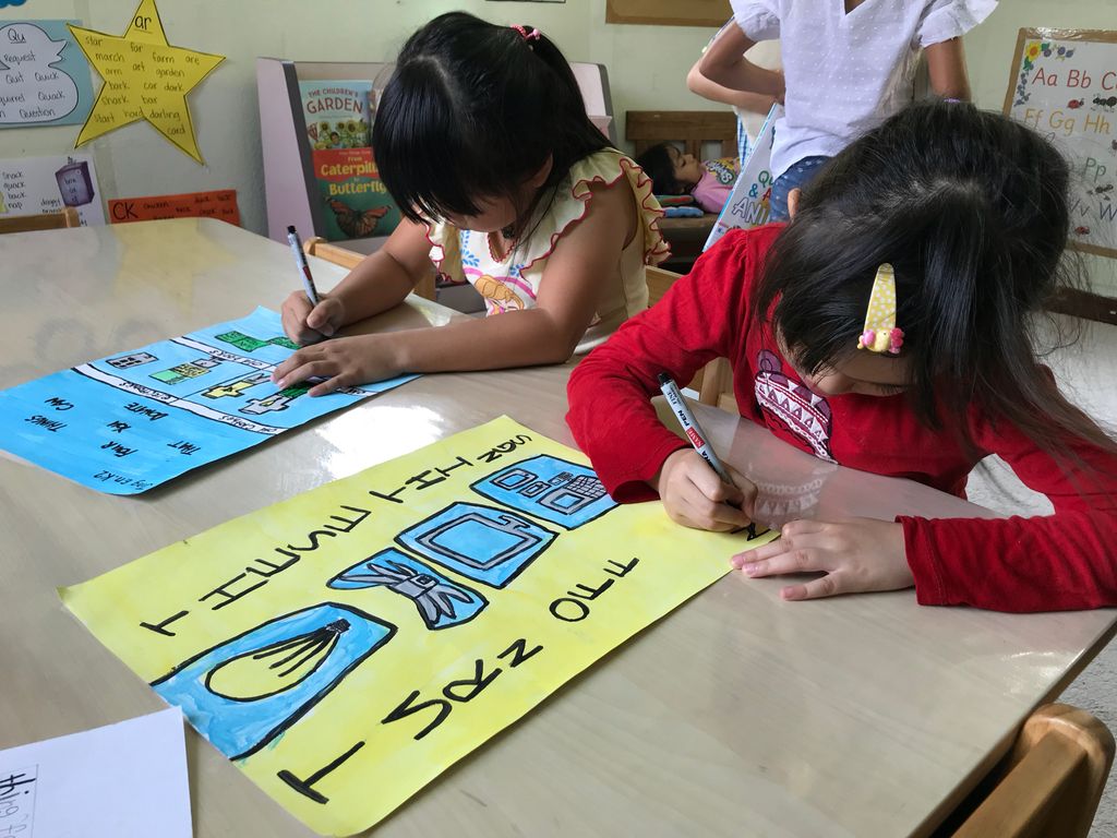 Superheroes Caring For The Environment: Distributing Posters to the Community — photo 1