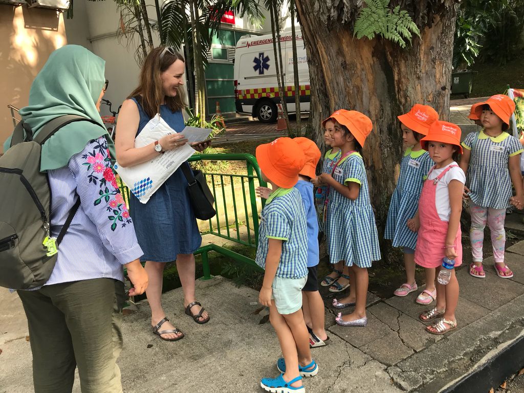 Superheroes Caring For The Environment: Distributing Posters to the Community — photo 1