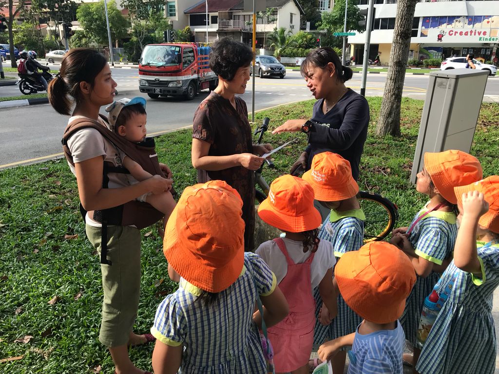 Superheroes Caring For The Environment: Distributing Posters to the Community — photo 2