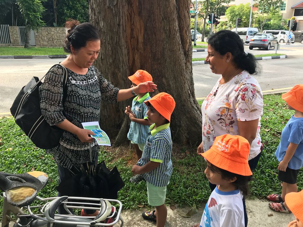 Superheroes Caring For The Environment: Distributing Posters to the Community — photo 4