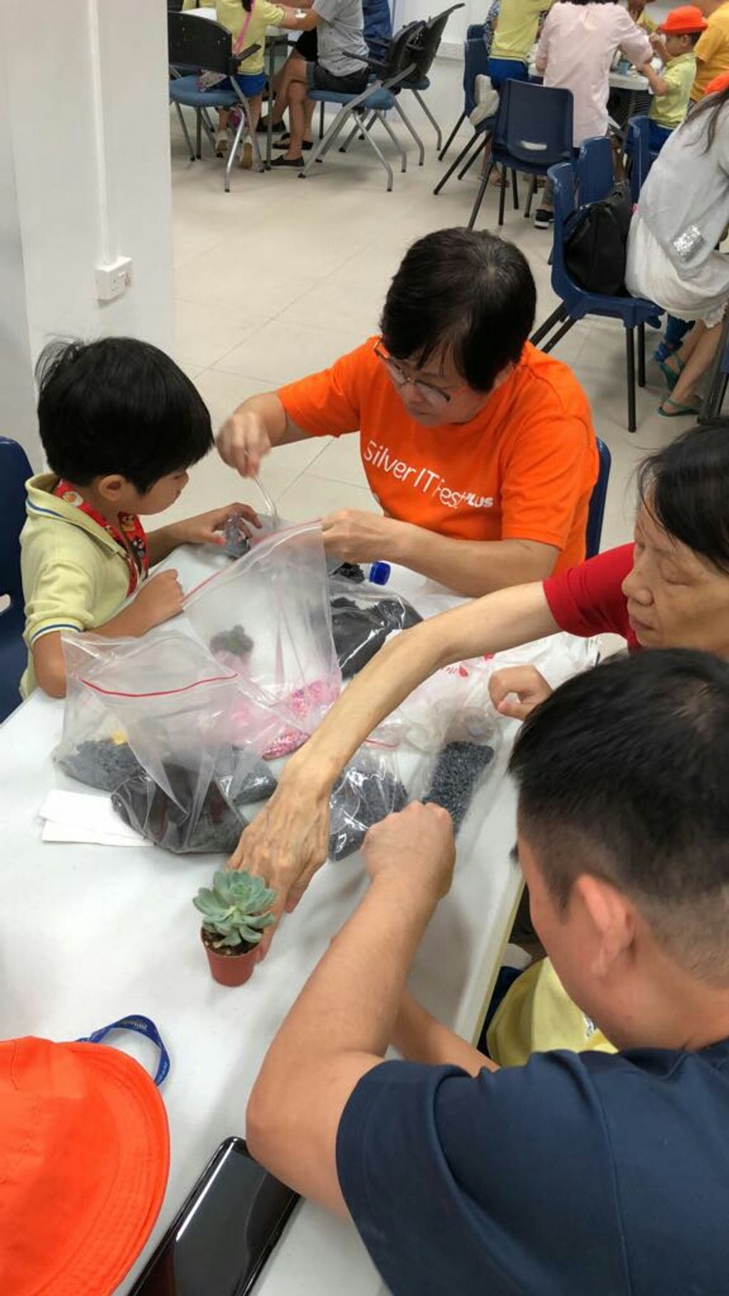 Intergenerational Bonding with the Seniors of MindCare Senior Activity Centre and NurtureStars Punggol through Terrarium Making! — photo 2