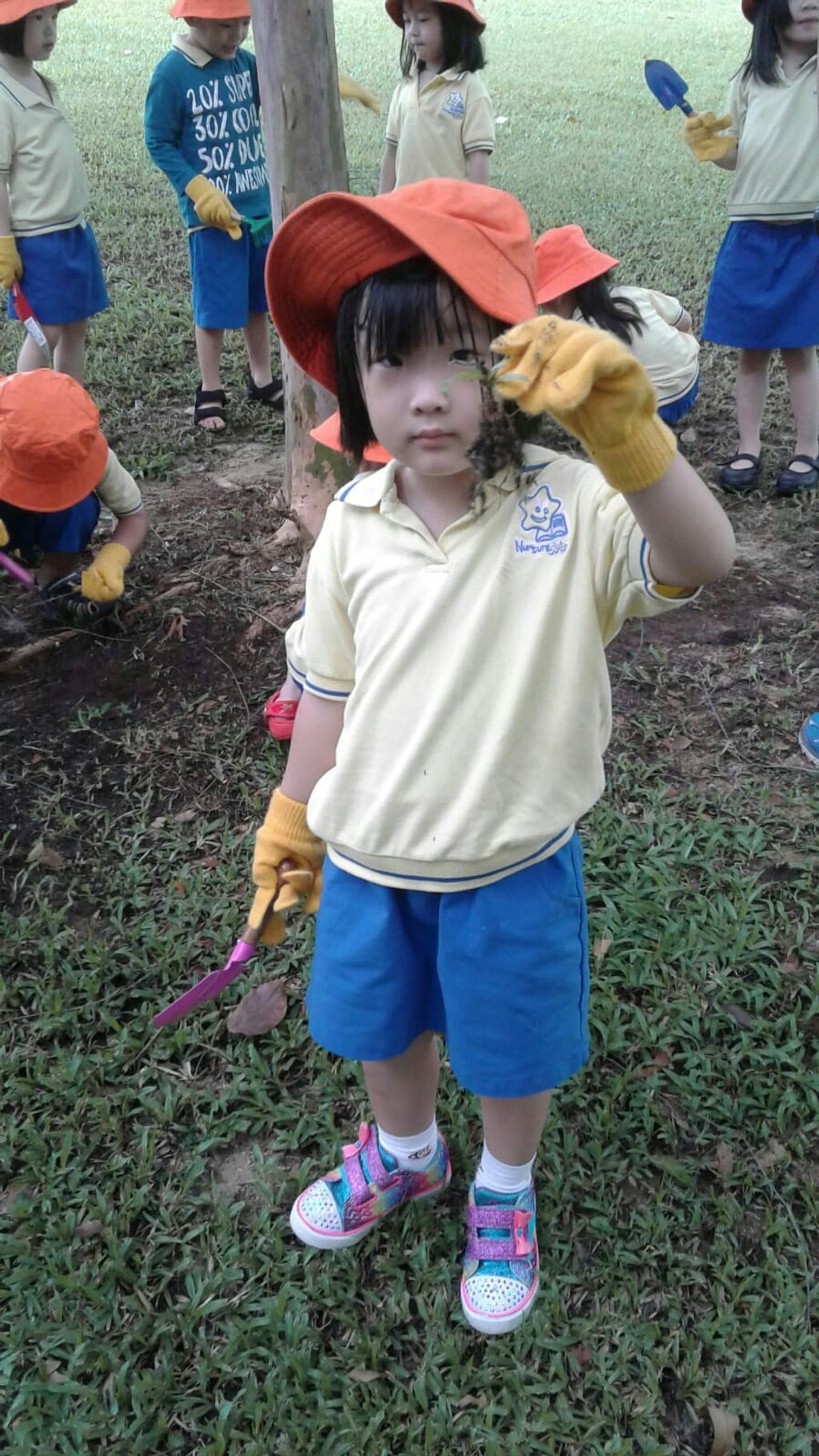 NurtureStars Punggol's Nursery students nurturing Punggol Waterway Park through mulching & weeding! — photo 2