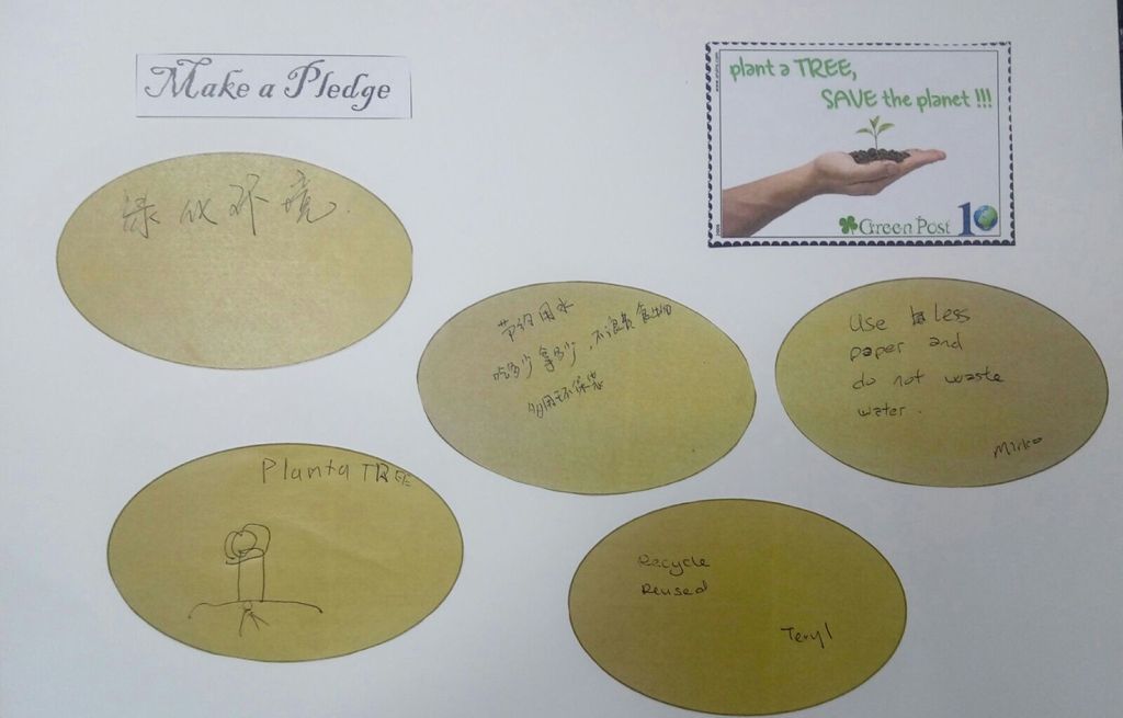 Let's pledge in saving our Environment! - children and parents penned down their pledges in the SSDB floor book .