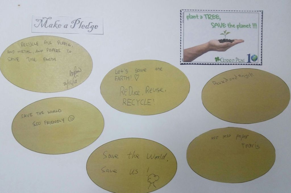 Let's pledge in saving our Environment! - children and parents penned down their pledges in the SSDB floor book . — photo 5